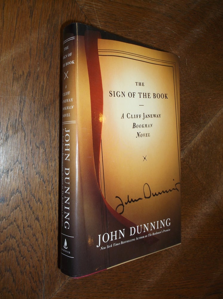 Item #11906 The Sign of the Book. John Dunning.