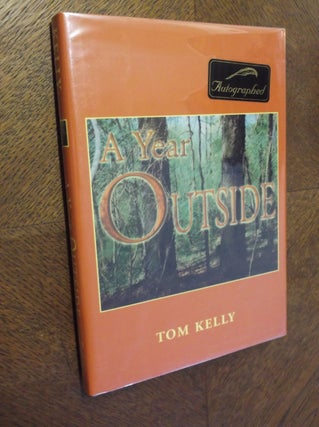 Item #16070 A Year Outside. Tom Kelly