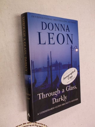 Item #20896 Through a Glass, Darkly: A Commissario Guido Brunetti Mystery. Donna Leon