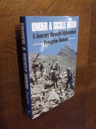 Item #24000 Under a Sickle Moon: Journey Through Afghanistan. Peregrine Hodson